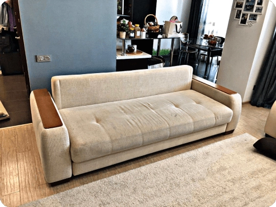 Worn cream sofa before reupholstery