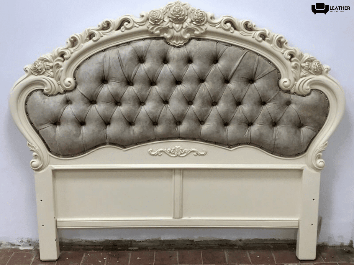 The same carved headboard after reupholstery in matte gray with the buttoning re-set
