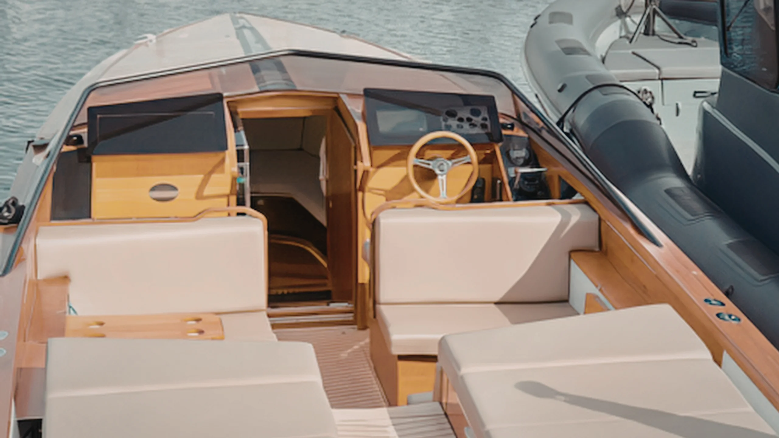 Cream marine upholstery on the cockpit seating of a motorboat