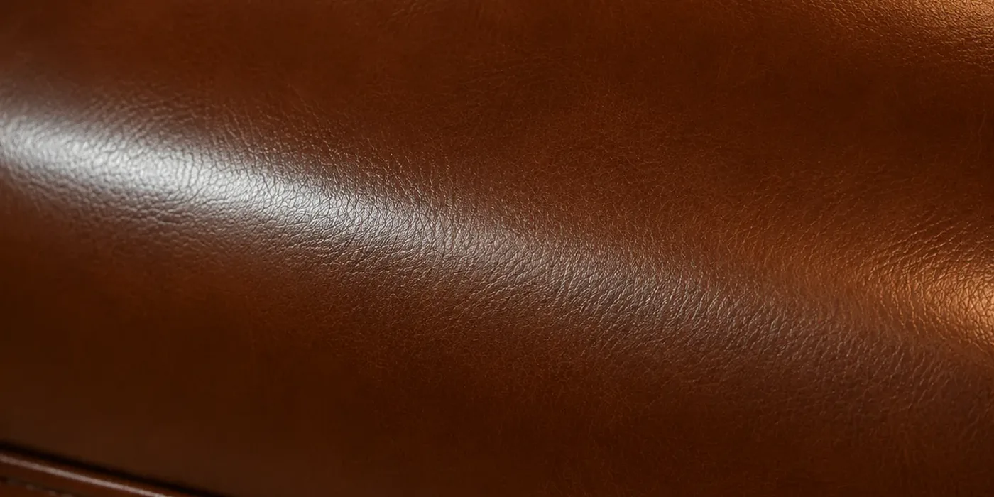 Macro of a recolored tan leather booth cushion with an even closed surface