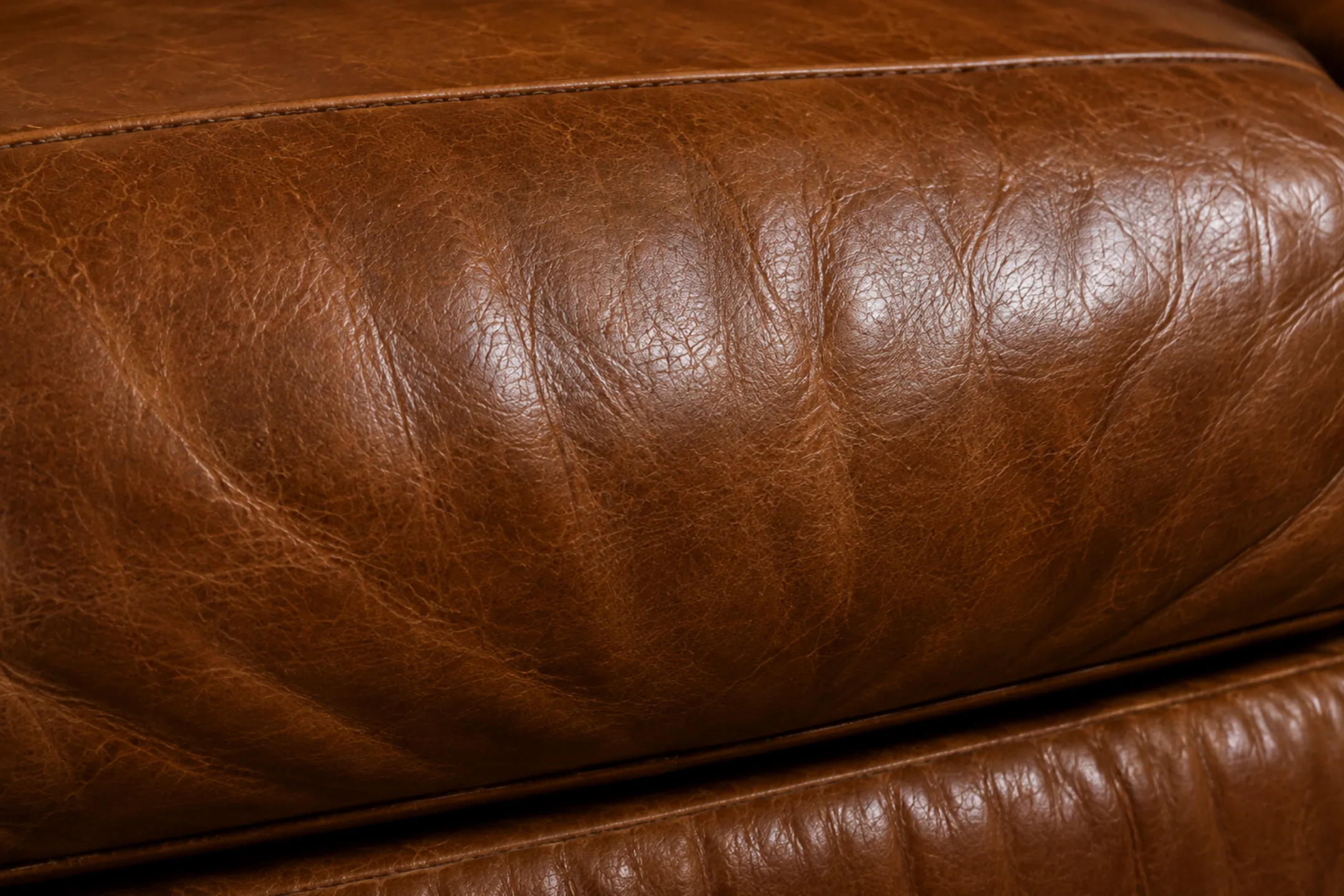 Furniture repair Paramus NJ: leather cushion with an even sheen after cleaning
