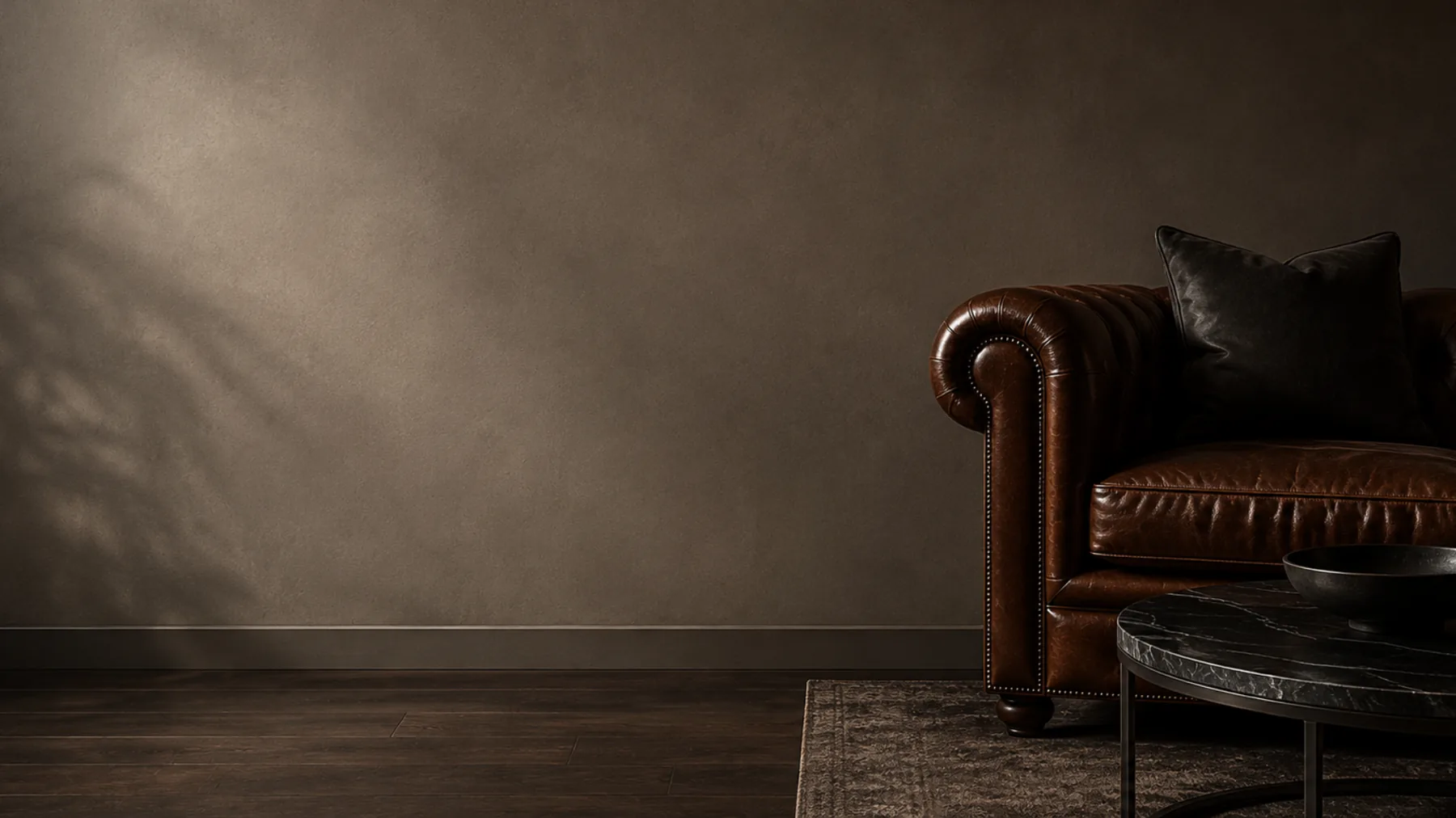 A restored chesterfield armchair reinstalled in a quiet room