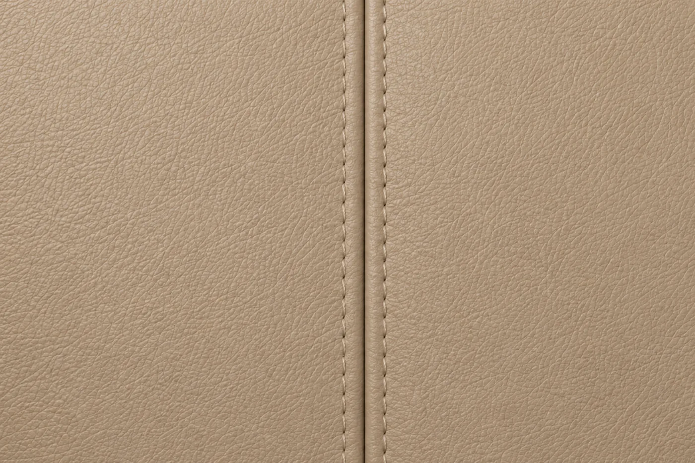 Two leather panels meeting at a seam, evenly colored