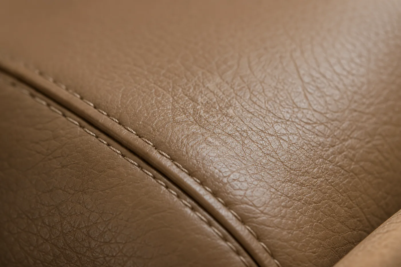A sealed and cured brown leather panel with a clean seam