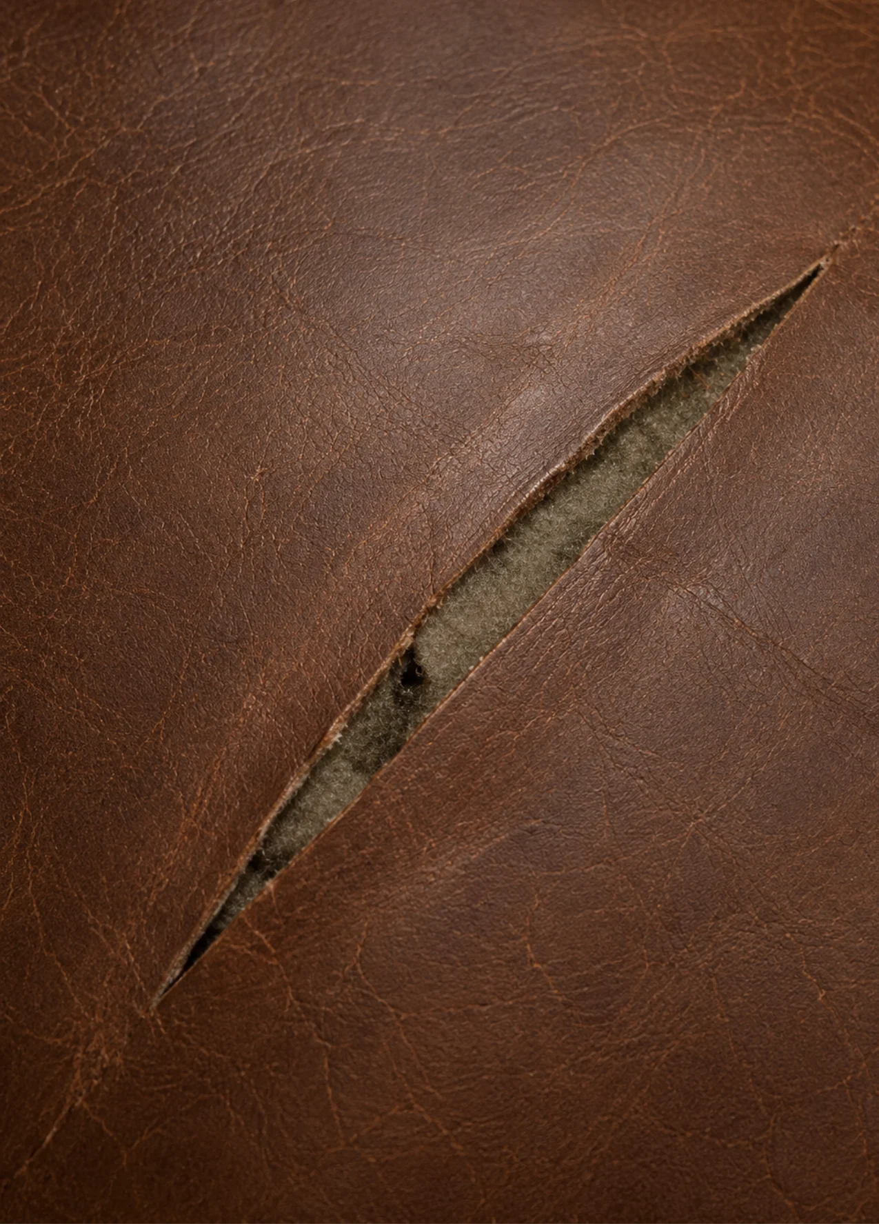Long straight slash in brown leather