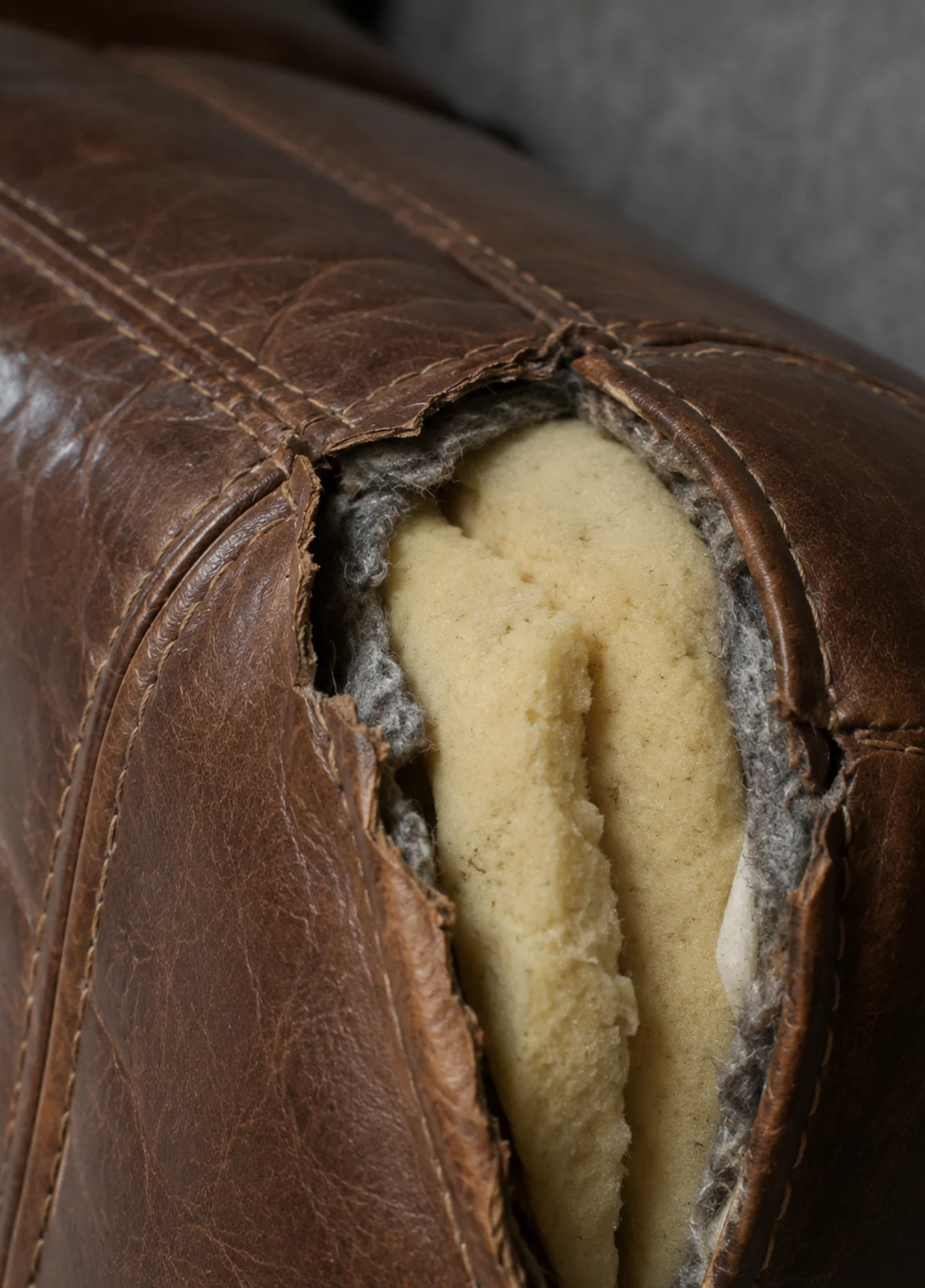 Leather sofa tear damage before repair