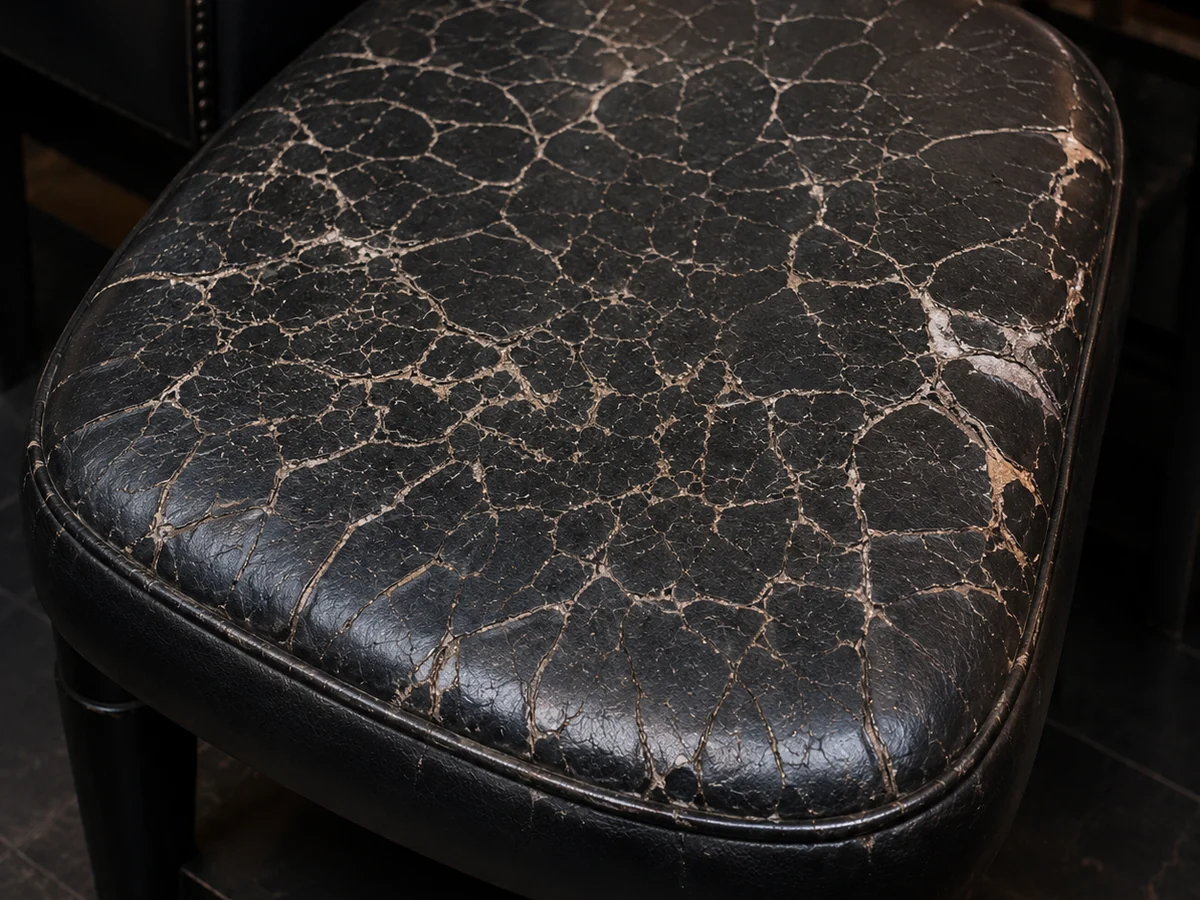 Bonded leather breaking up across a seat