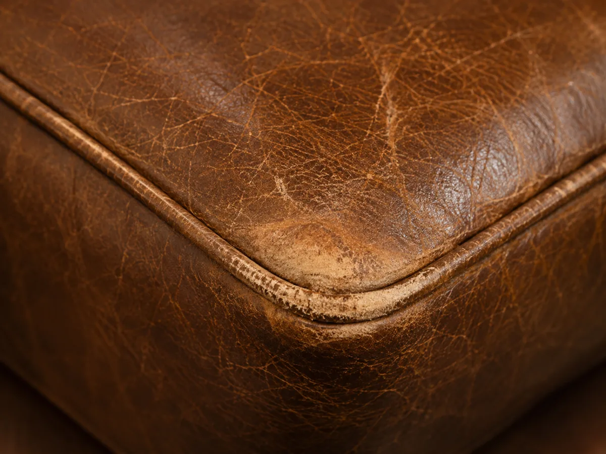 Worn outside corner on a leather booth end