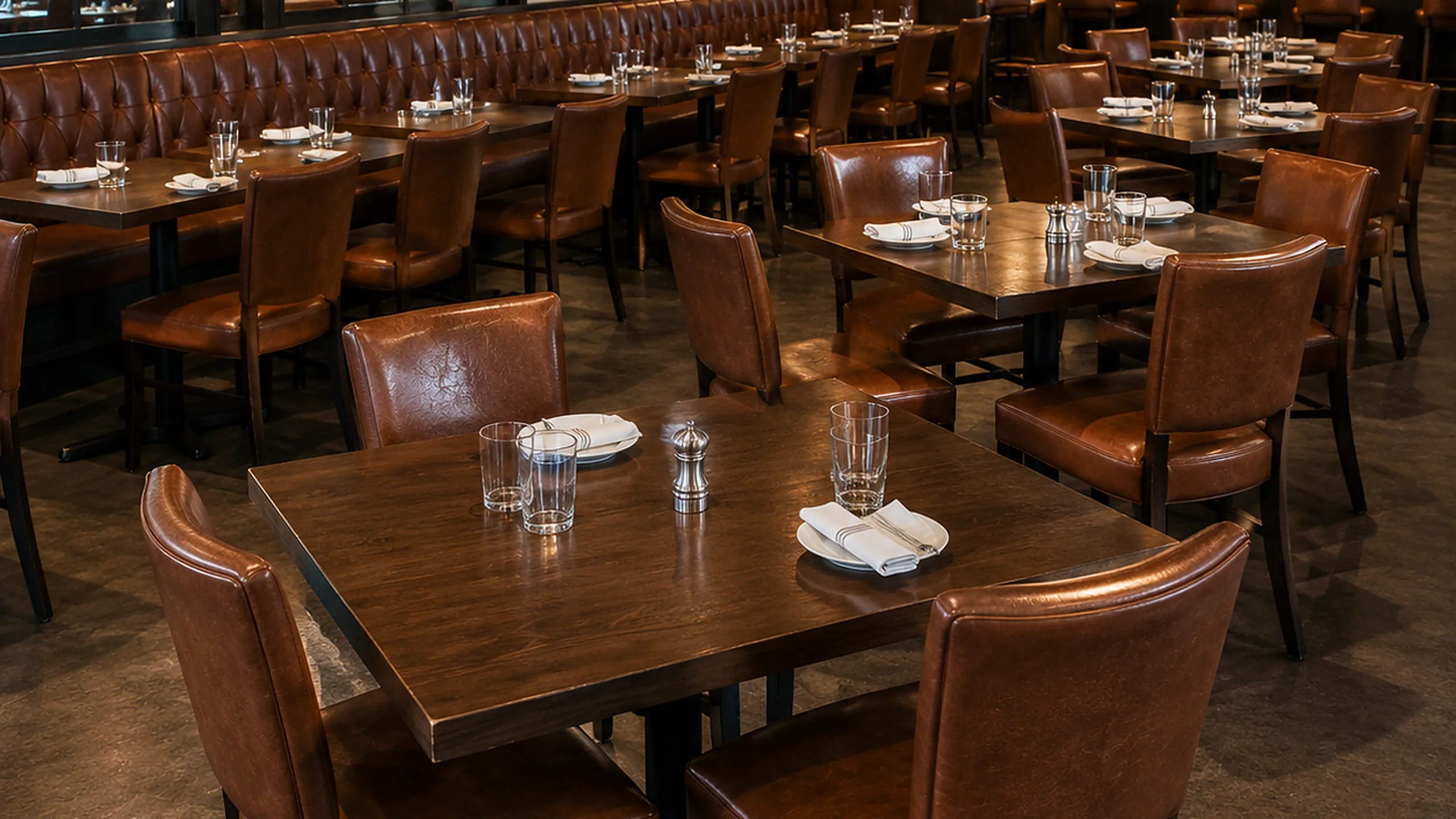 Commercial furniture restoration NYC — restaurant dining room with leather chairs and booths