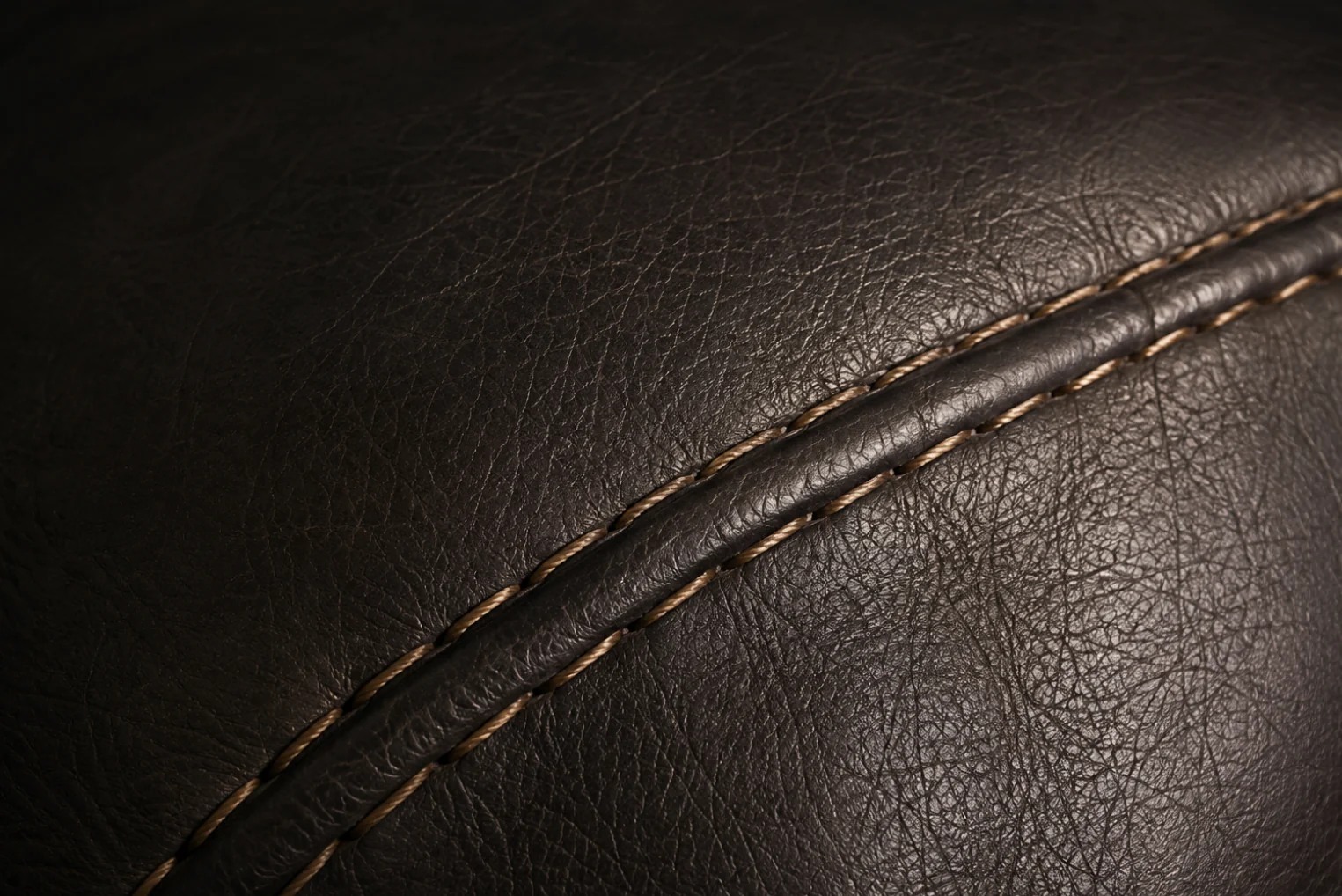 Dark pigmented leather with a stitched seam