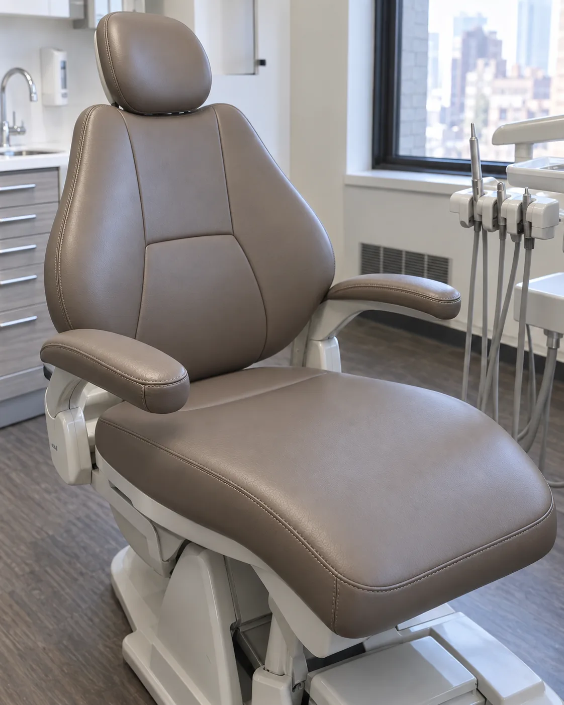 The same dental chair with a recovered taupe seat