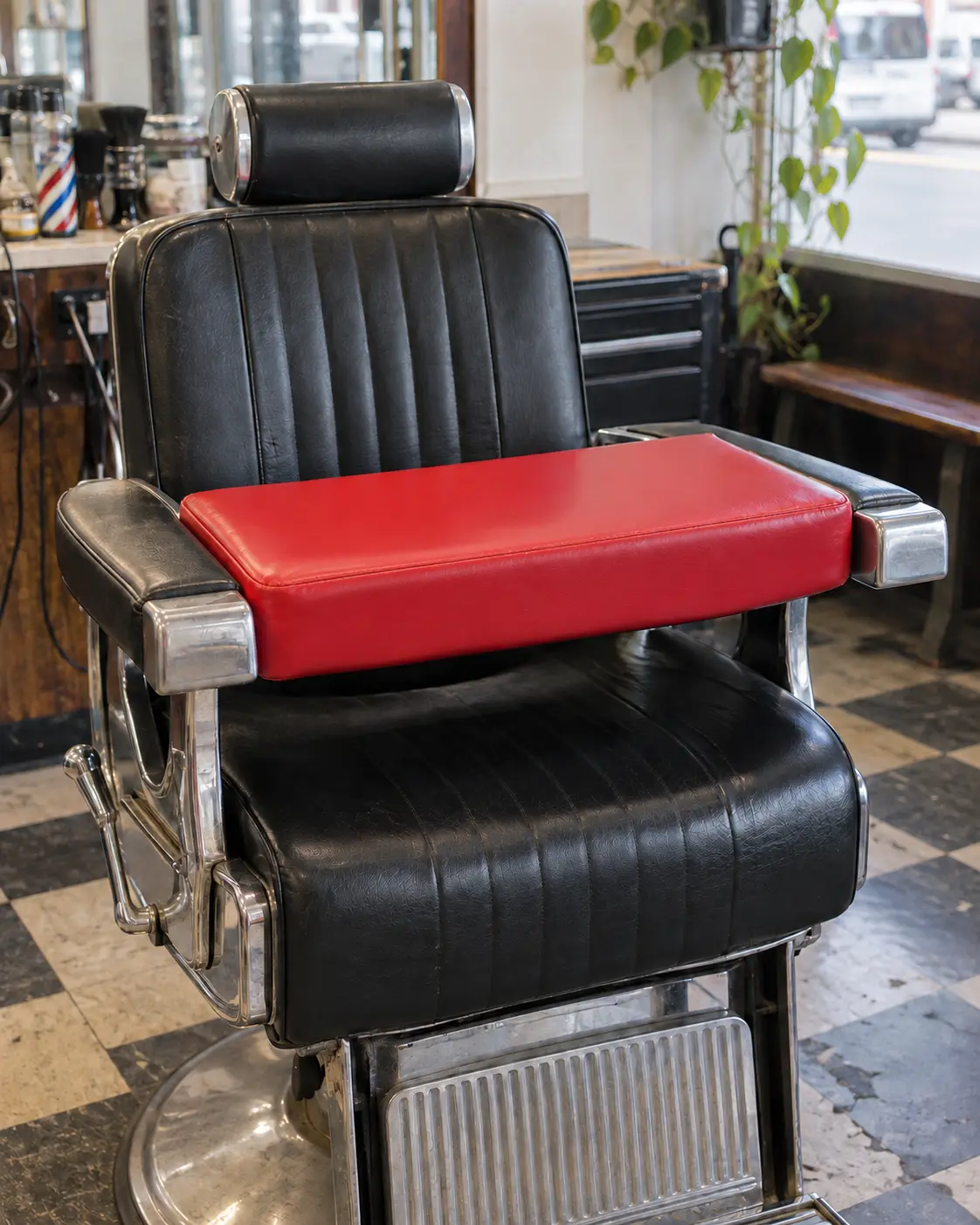 The same kids booster seat recovered in red vinyl