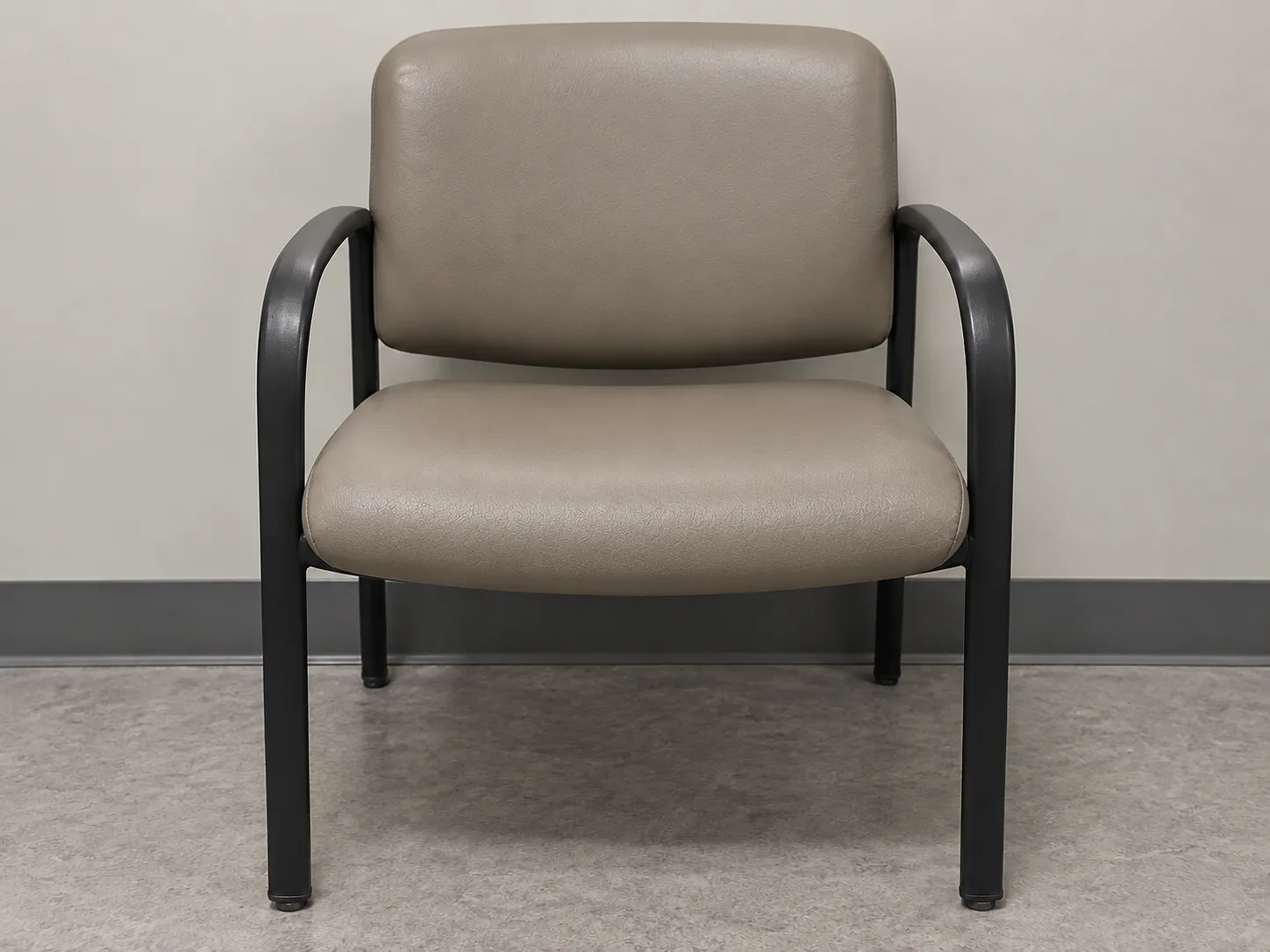 The same waiting room chair with its seat reupholstered