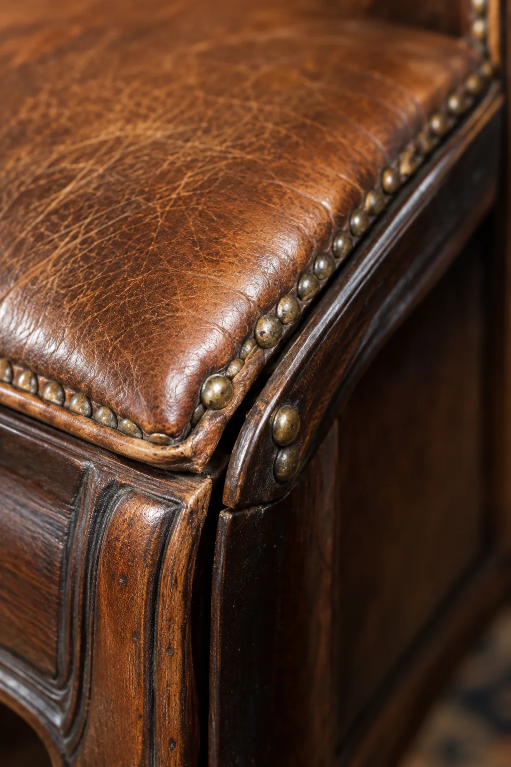 Close-up of a loose corner joint on an antique leather armchair