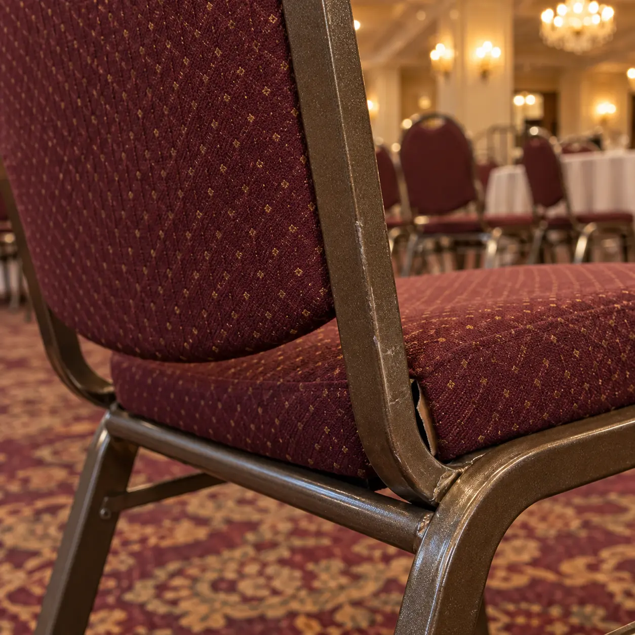 A loose back joint on a banquet chair frame
