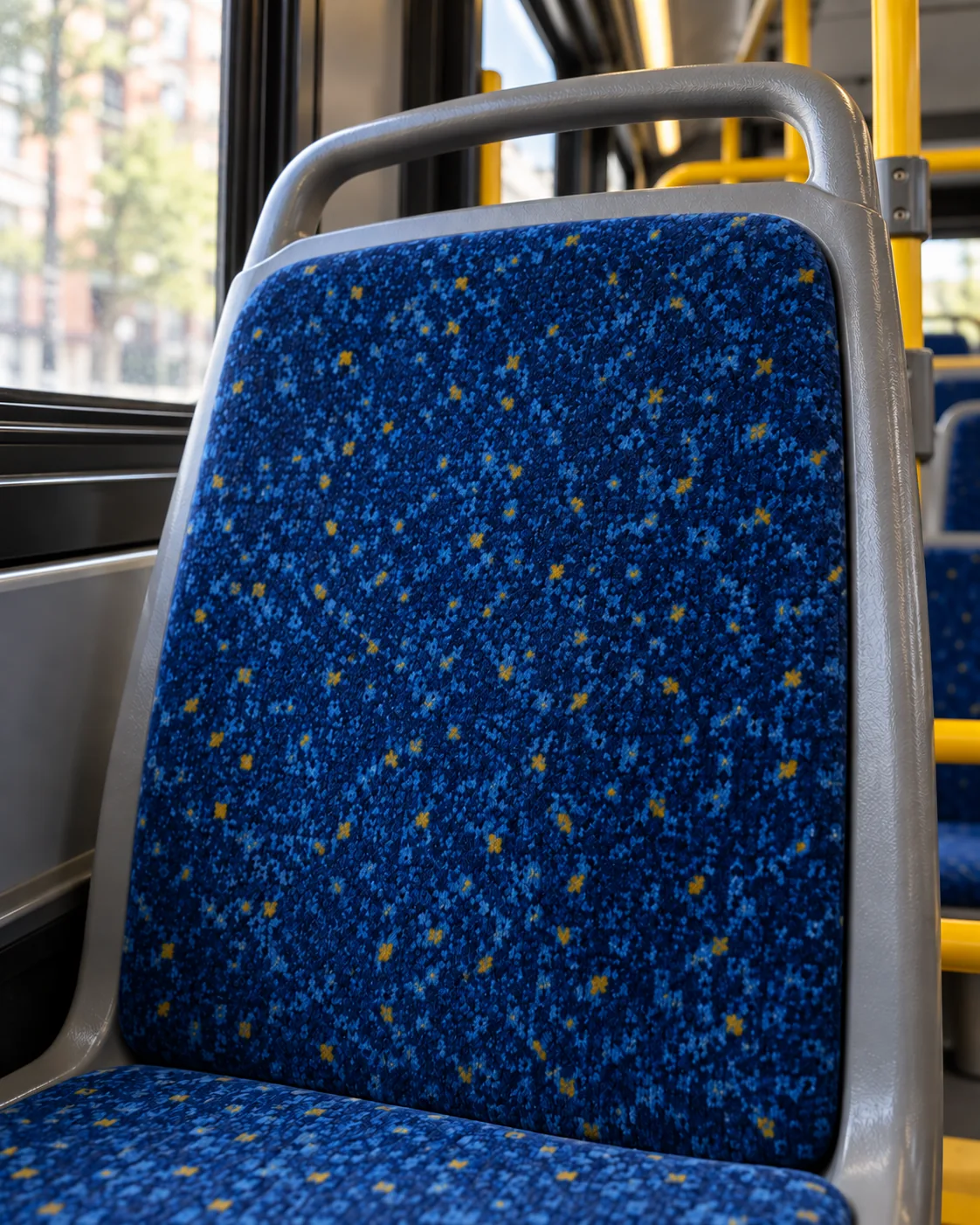 A bus seat cushion with a burn hole