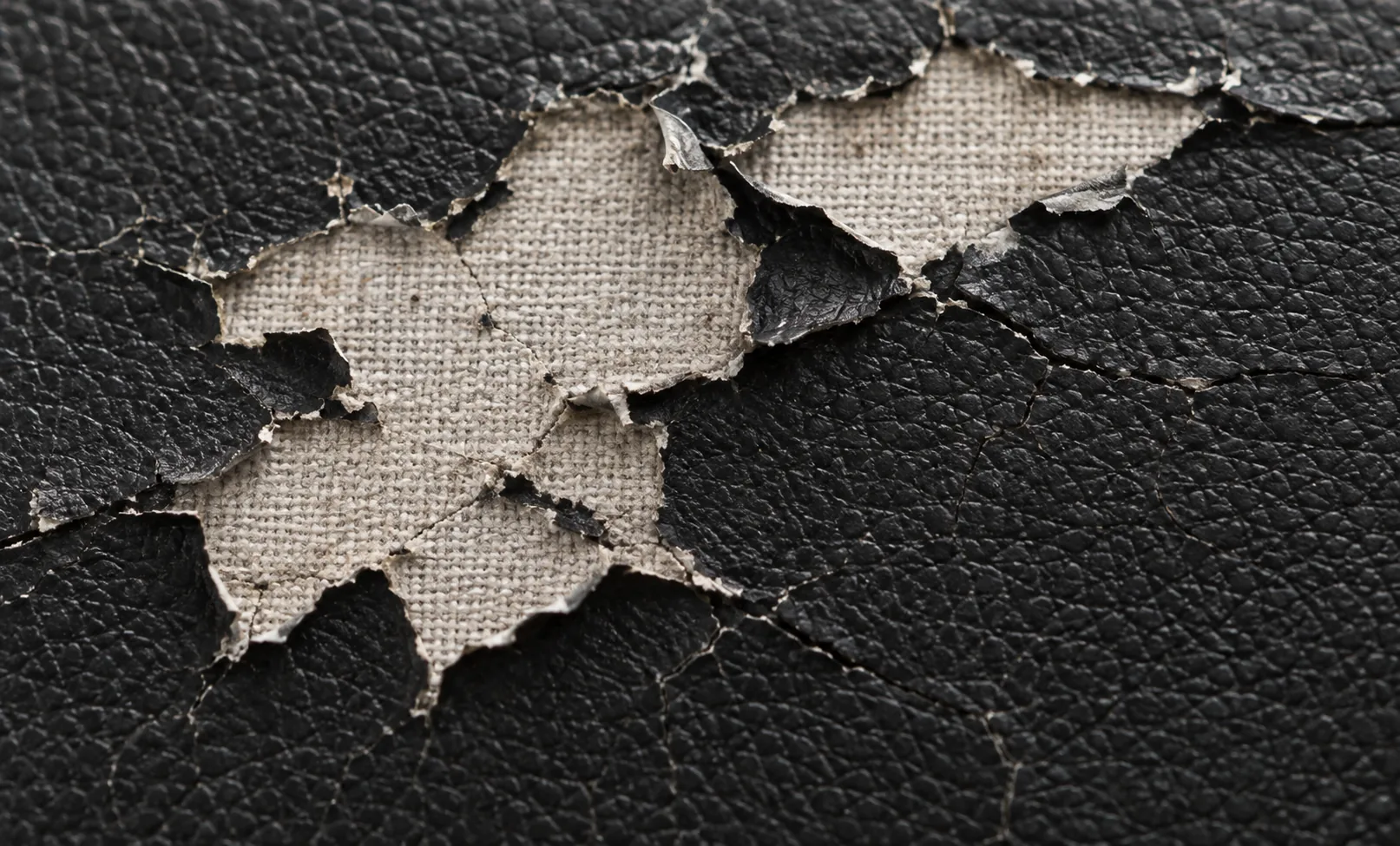 Bonded leather peeling off its woven backing