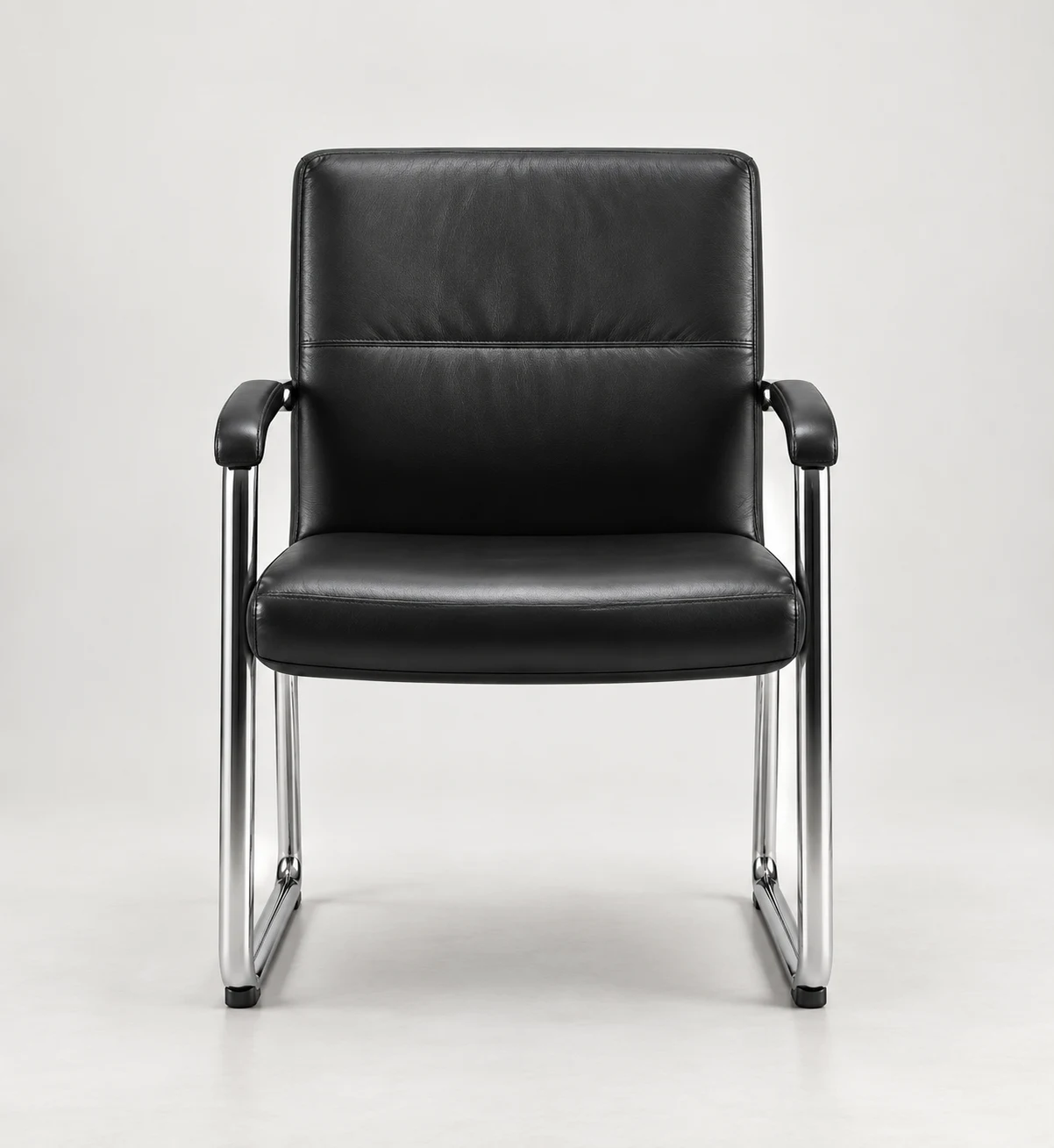 Black leather conference chair with padded arms on a chrome sled base