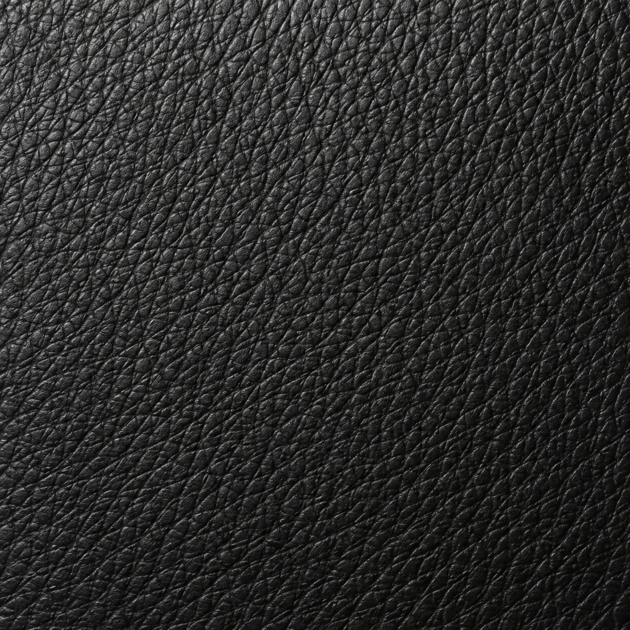 Black leather grain texture up close