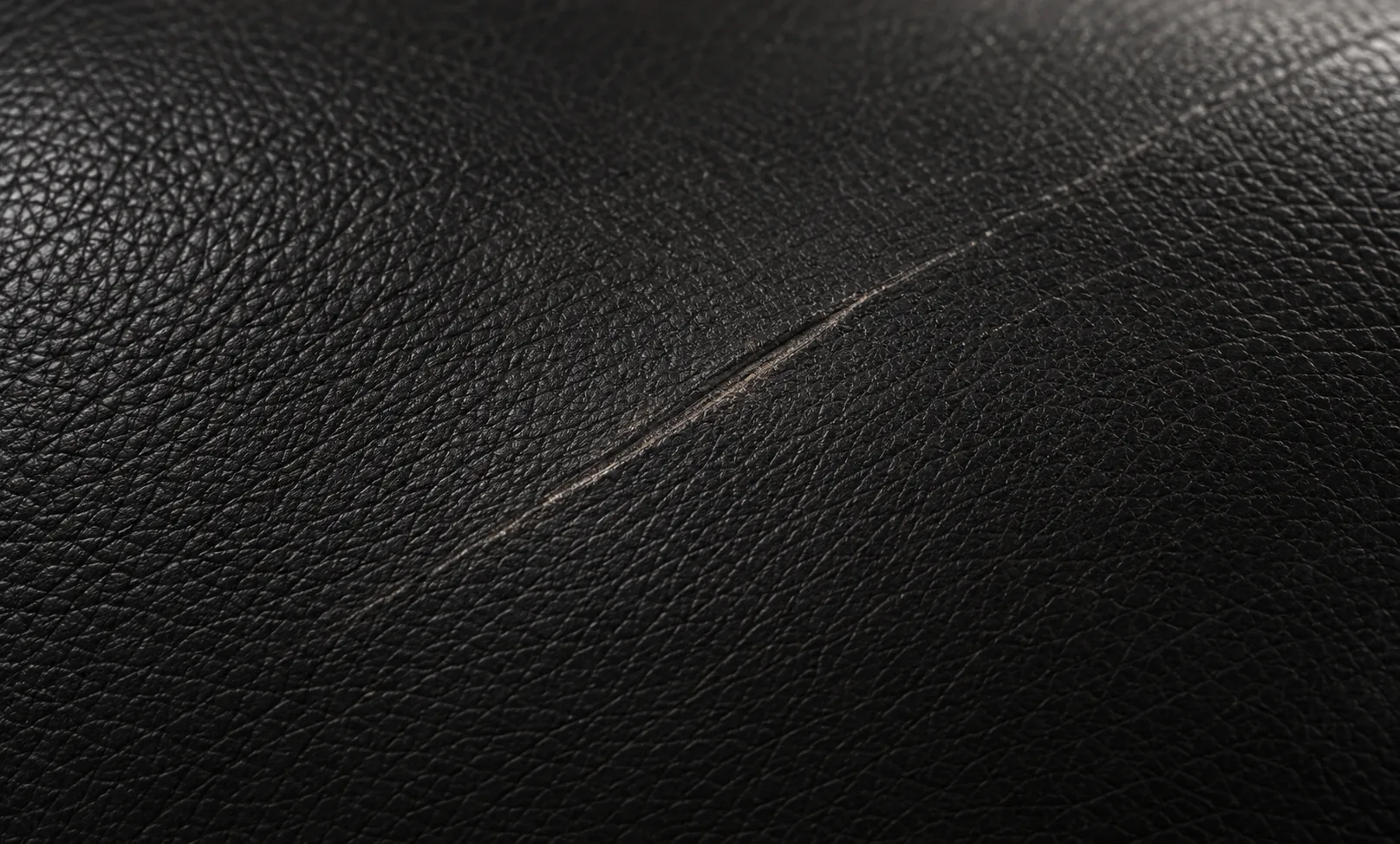 Single scratch on black leather