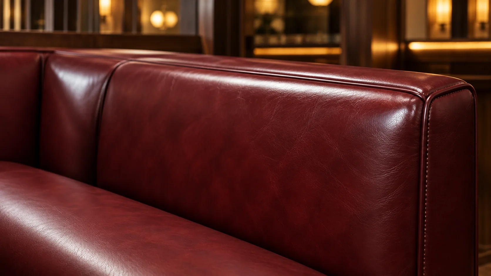 Leather lounge seating recolored in a deep oxblood