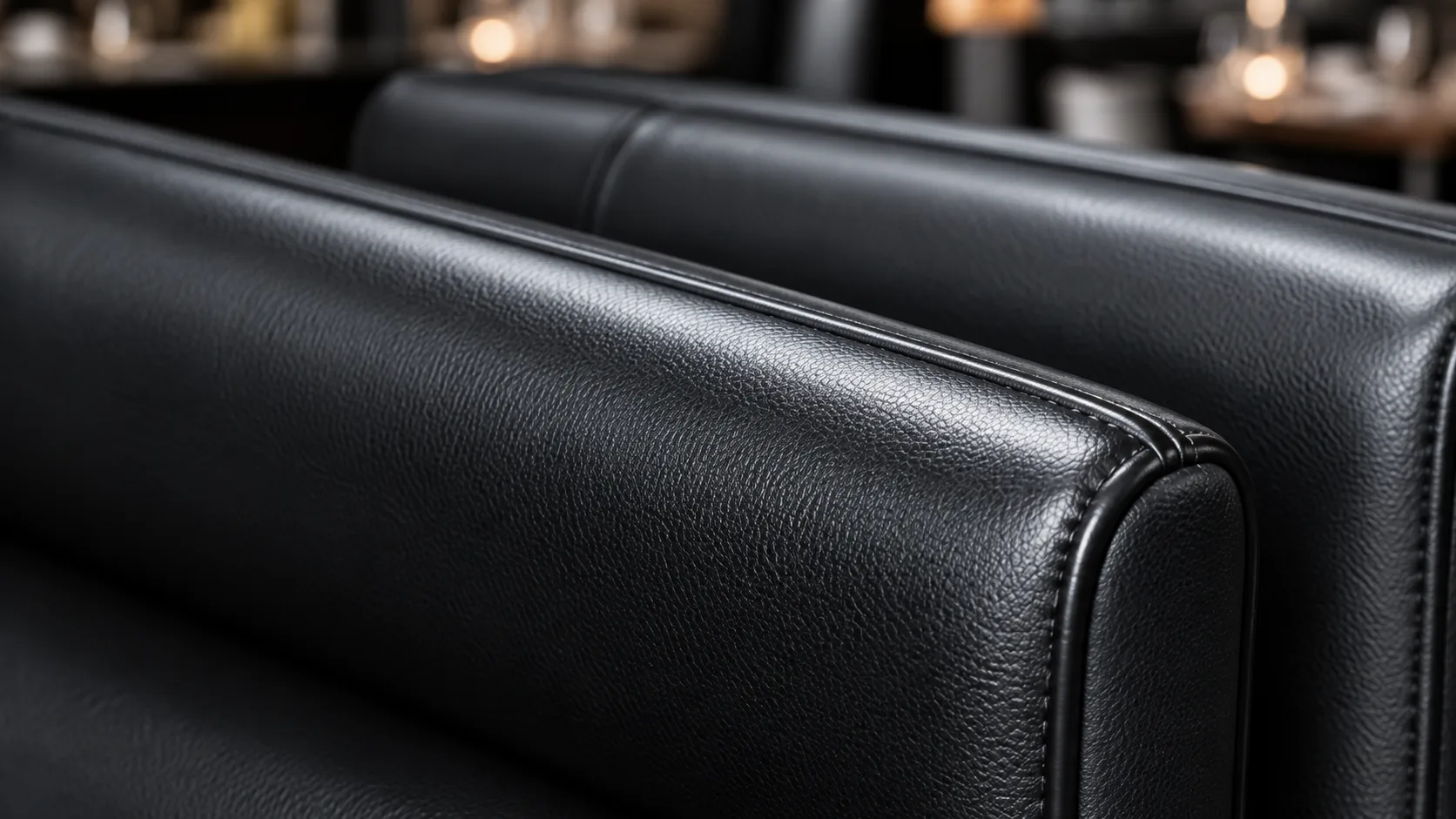 Black leather sofa after full commercial reupholstery