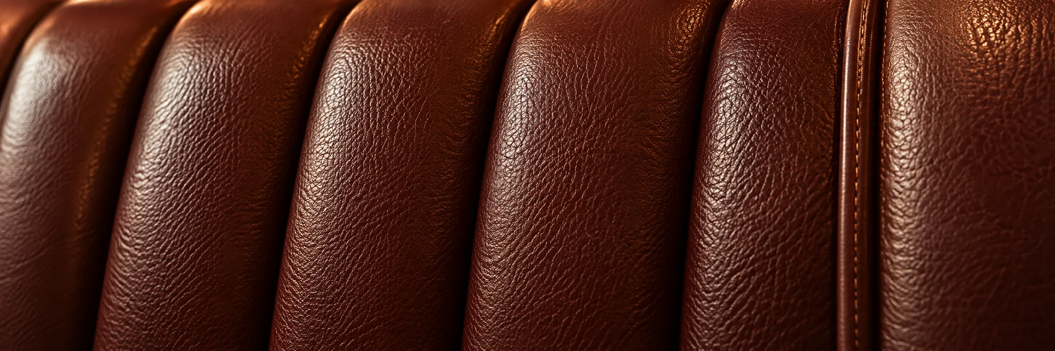 Close-up of channelled brown leather on a booth back