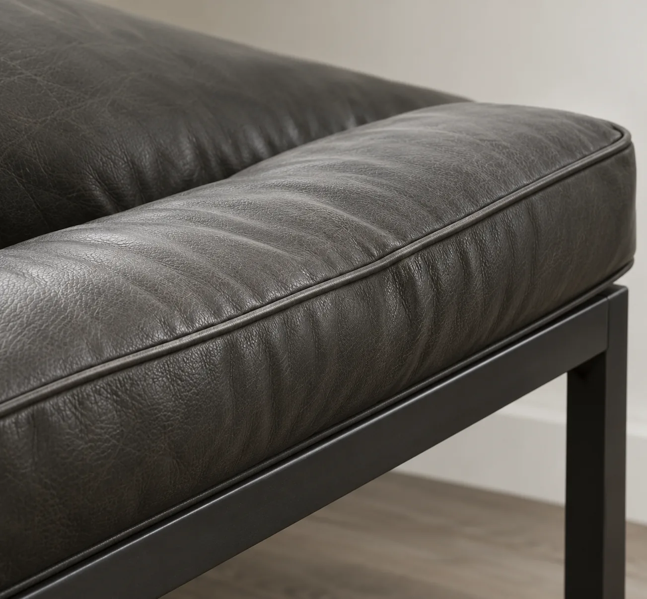Leather bench on a black metal frame