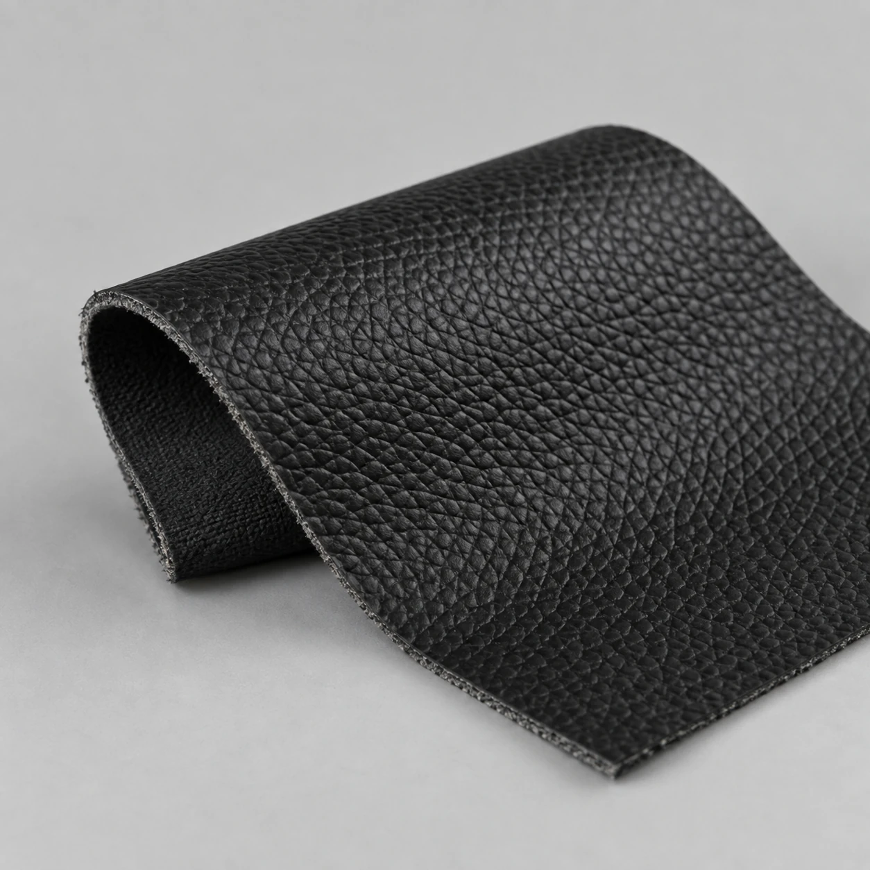 A black contract vinyl swatch for cinema seating