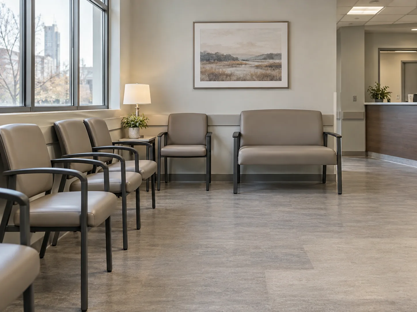 Waiting room chairs and a loveseat in a bright clinic
