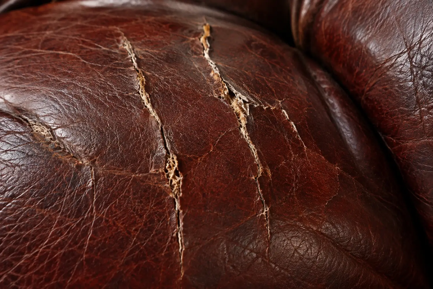 Oxblood leather cracked through to the fibers