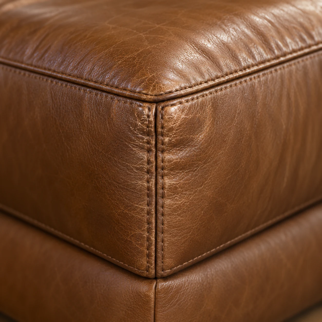 Corner block of a cognac leather sectional