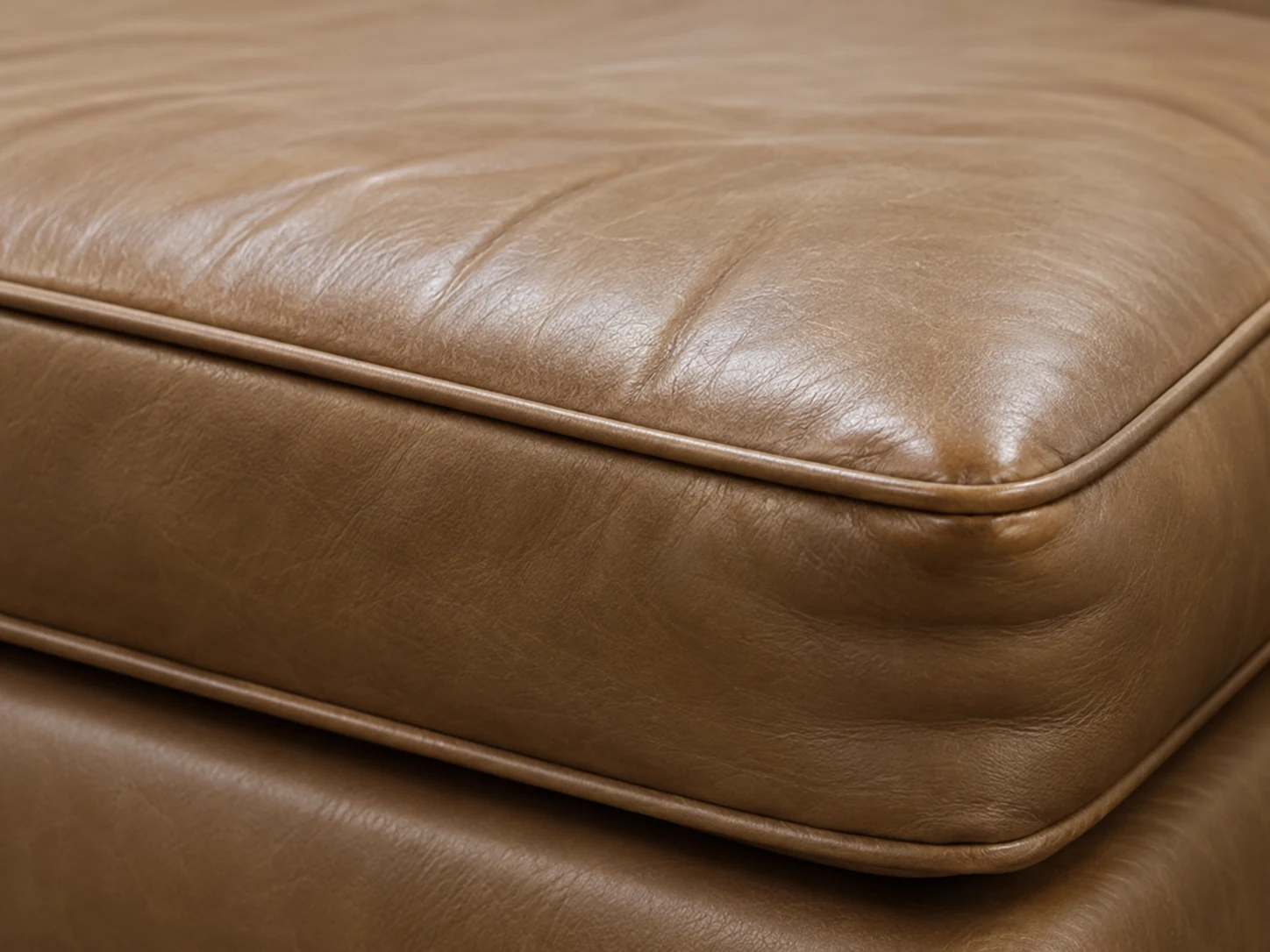Collapsed tan leather cushion edge