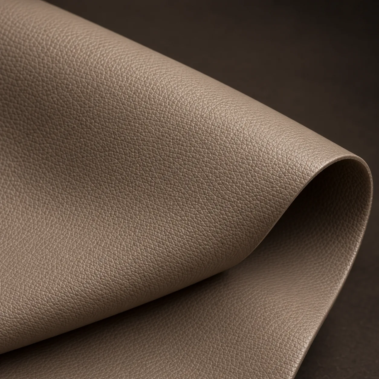 A swatch of taupe commercial vinyl for office seating