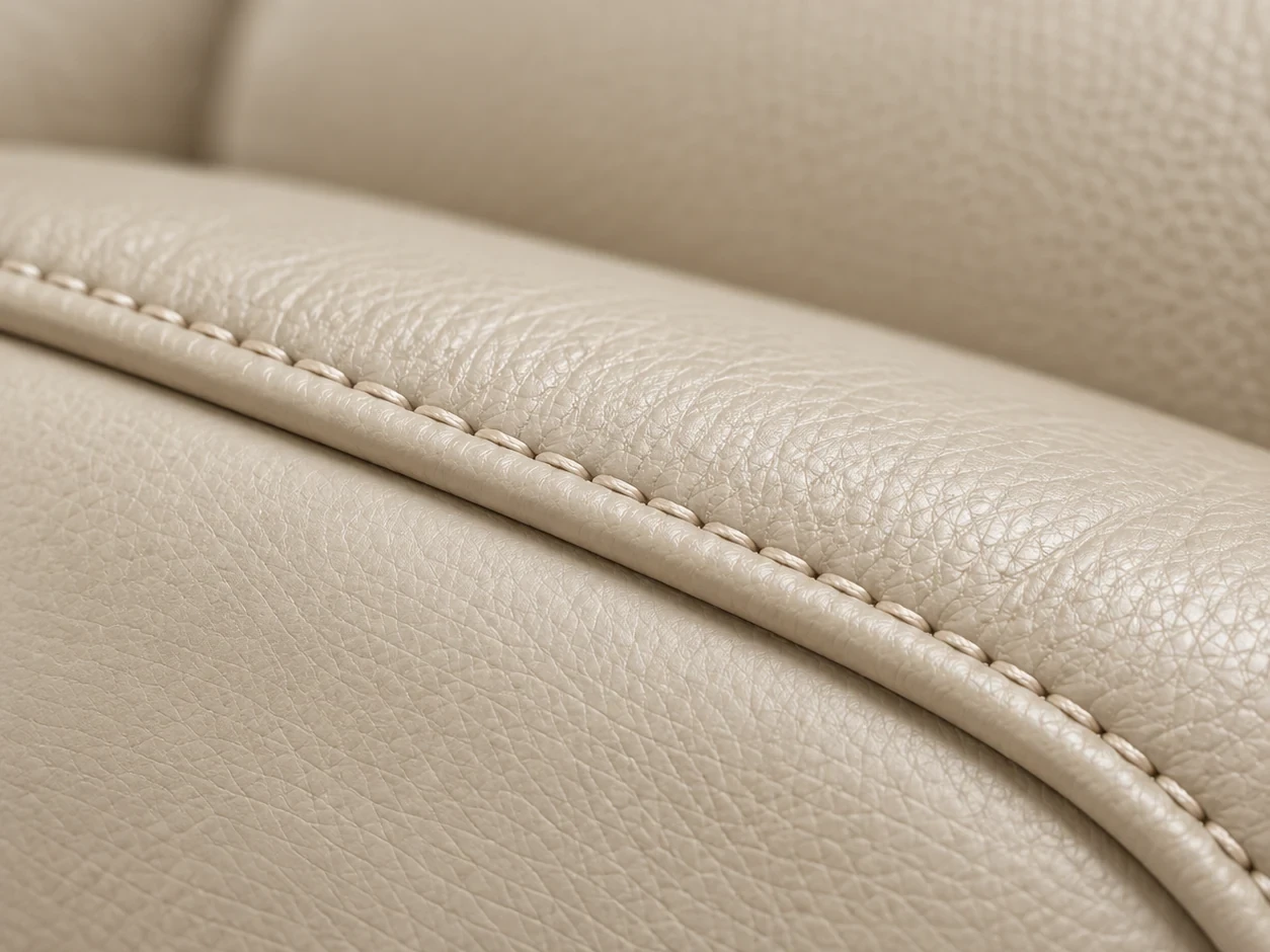 Stitching along a cream leather cushion seam