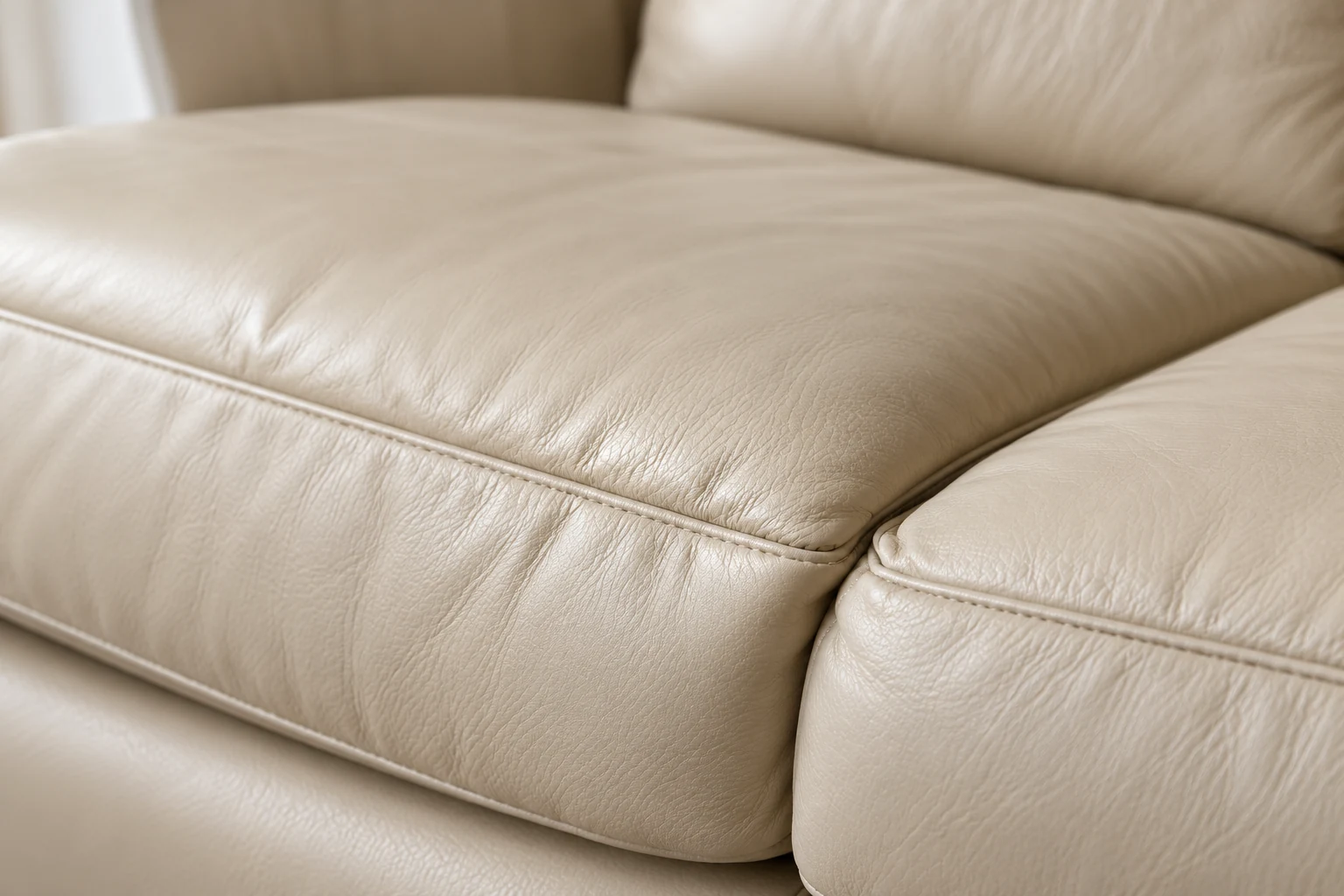 Uneven cream leather sofa cushion