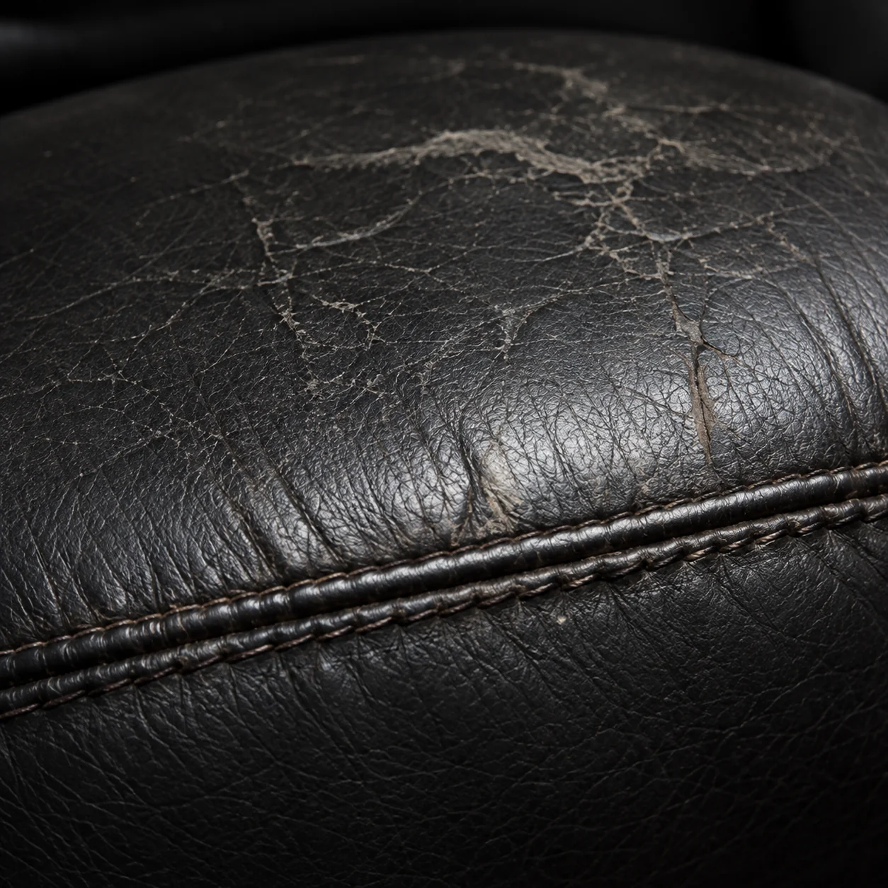 Cracked seat back beside a seam