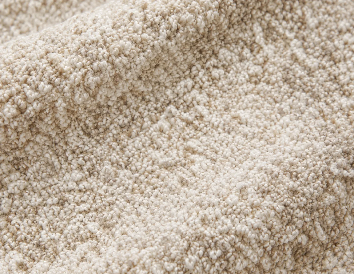 Cream bouclé swatch with looped yarn for a headboard