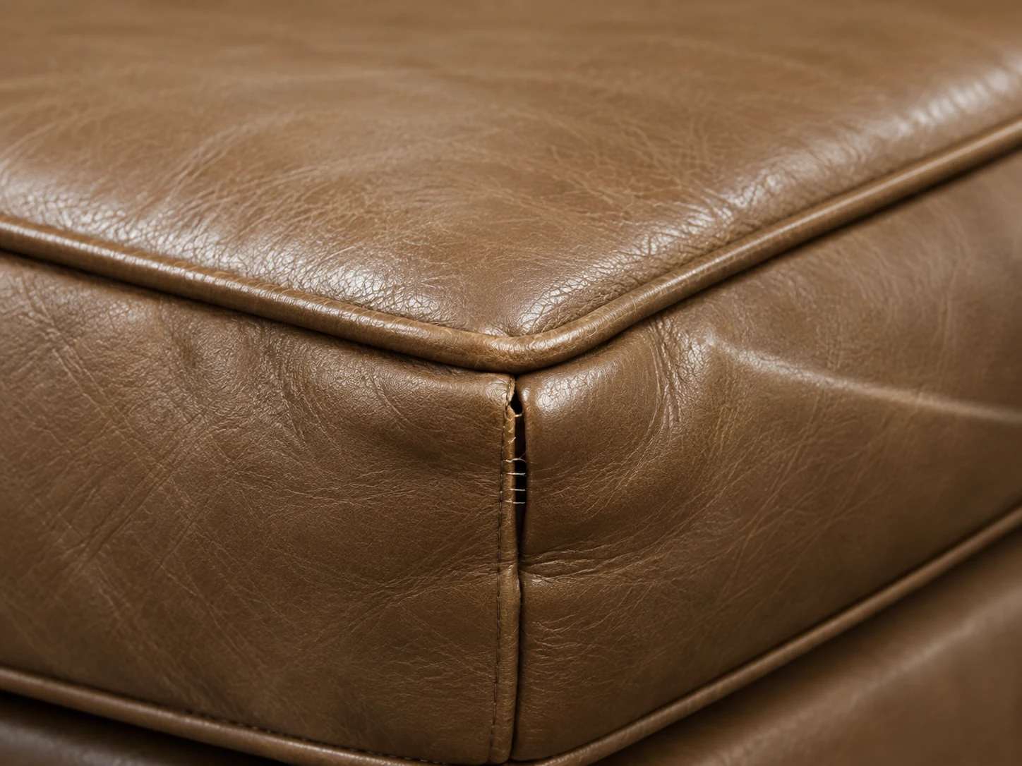 Brown leather cushion corner with split welt