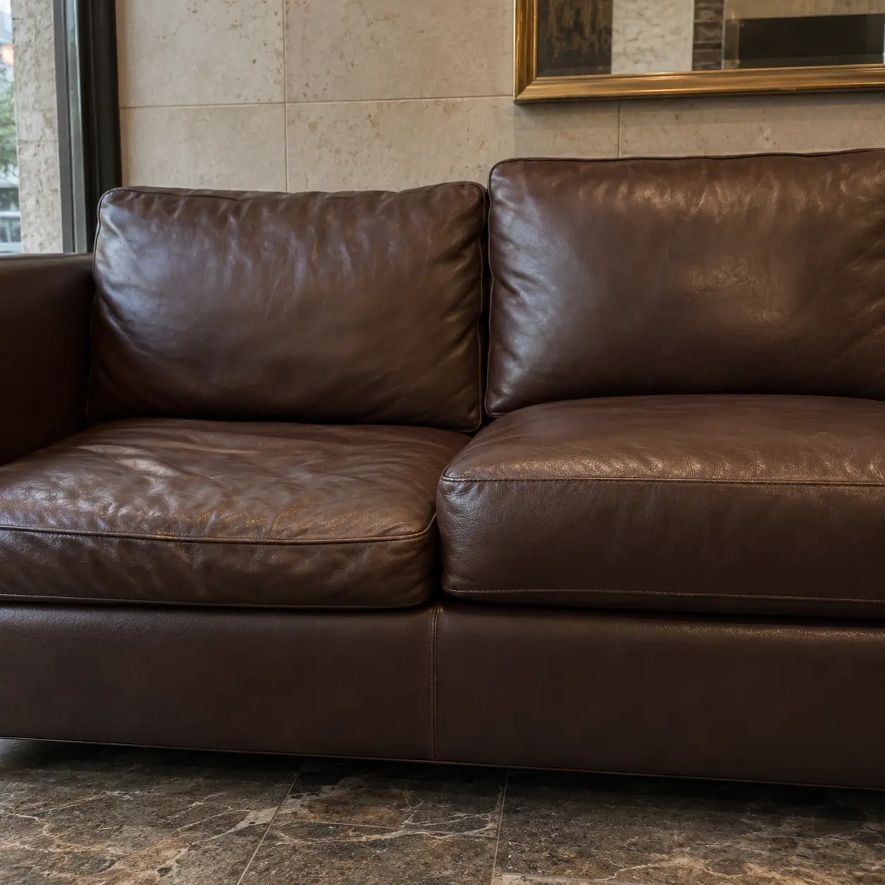 One sofa cushion sitting lower than its neighbour