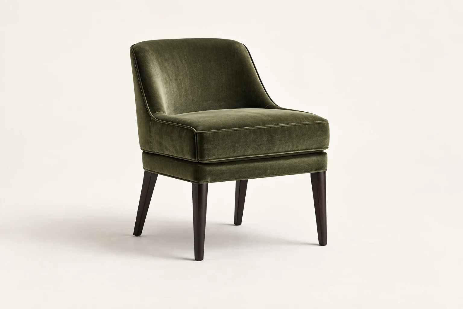 Green velvet dining chair on dark legs