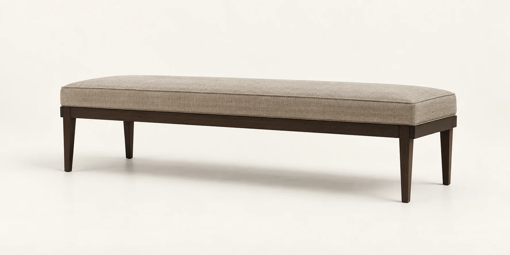 Long upholstered bench in taupe with tapered walnut legs
