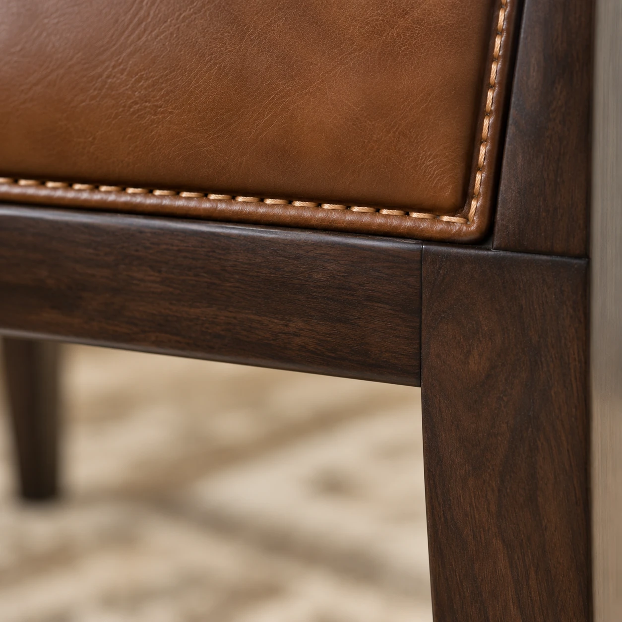 Brown leather meeting a wooden chair frame