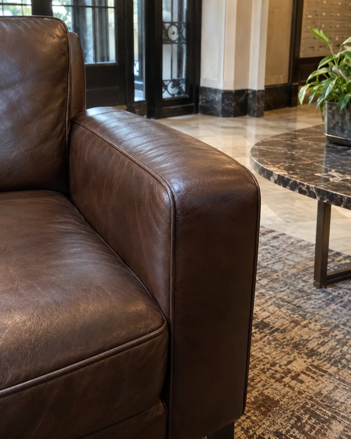 A leather lounge chair arm color touched and even again