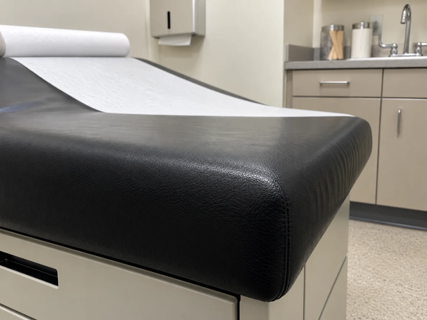 After: the same exam table corner closed, grained and sealed