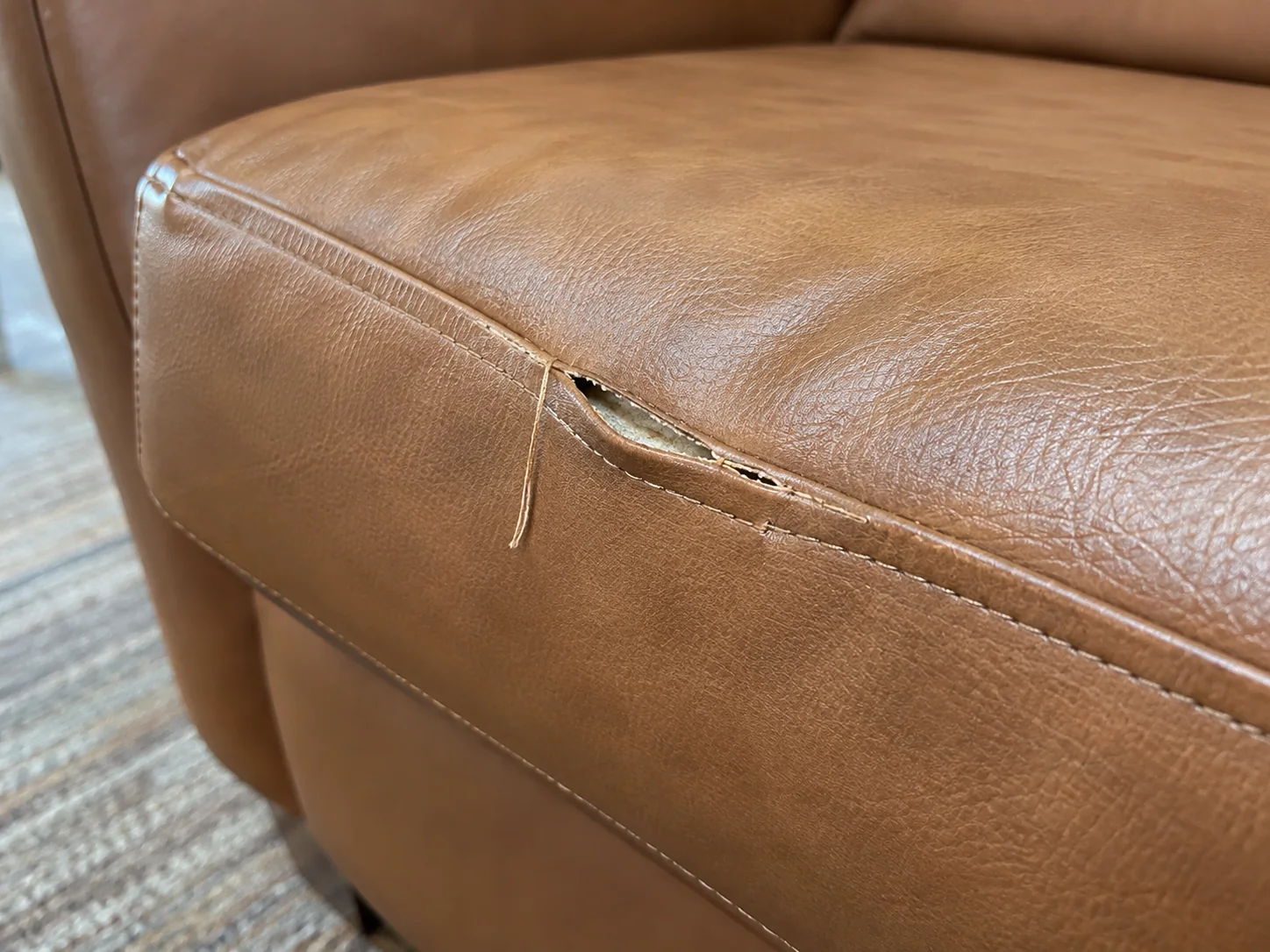 A failed seam on a vinyl lounge cushion