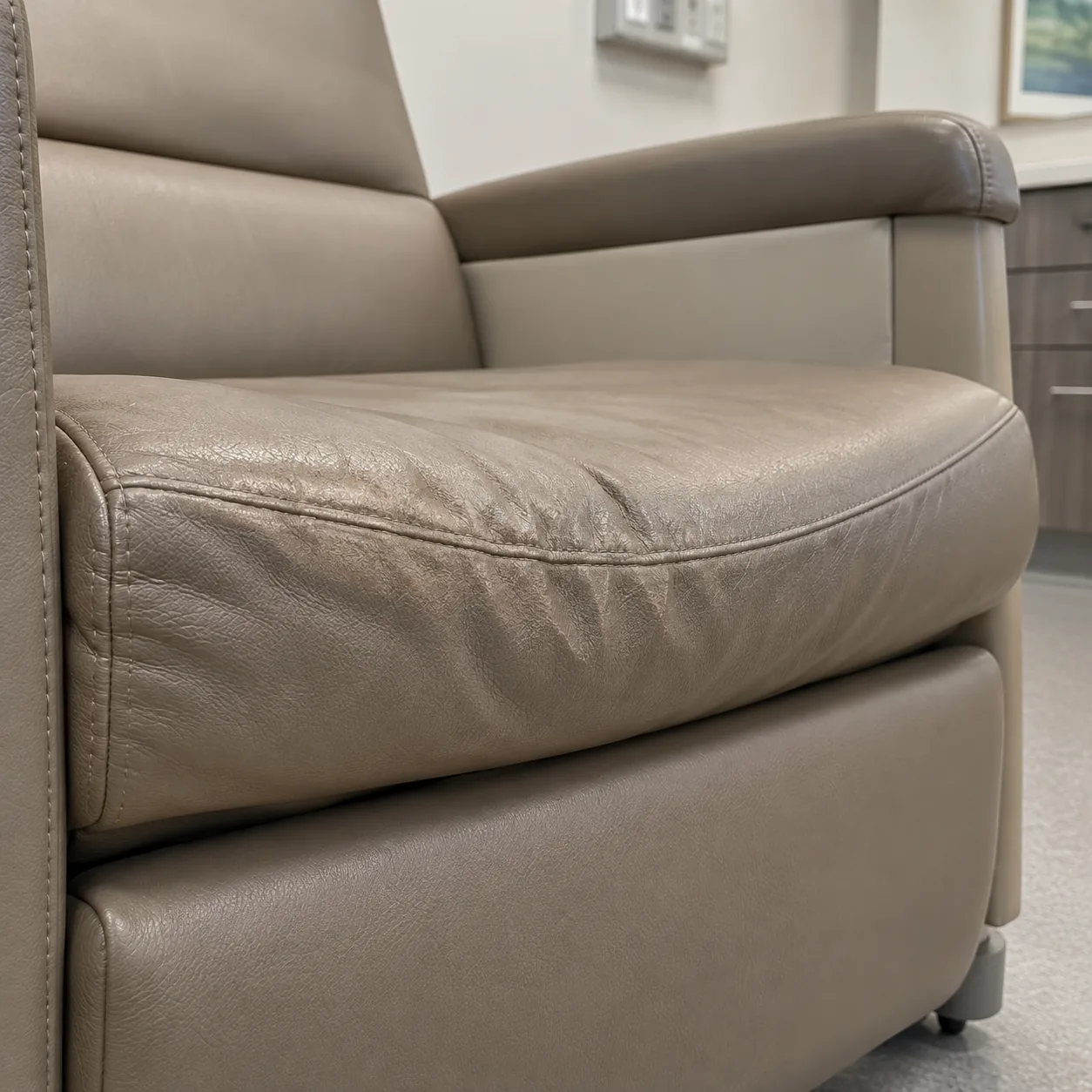Flattened foam in a taupe recliner seat