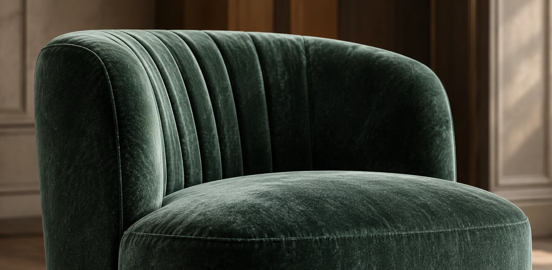 Green velvet channel-back chair newly reupholstered in panelled light
