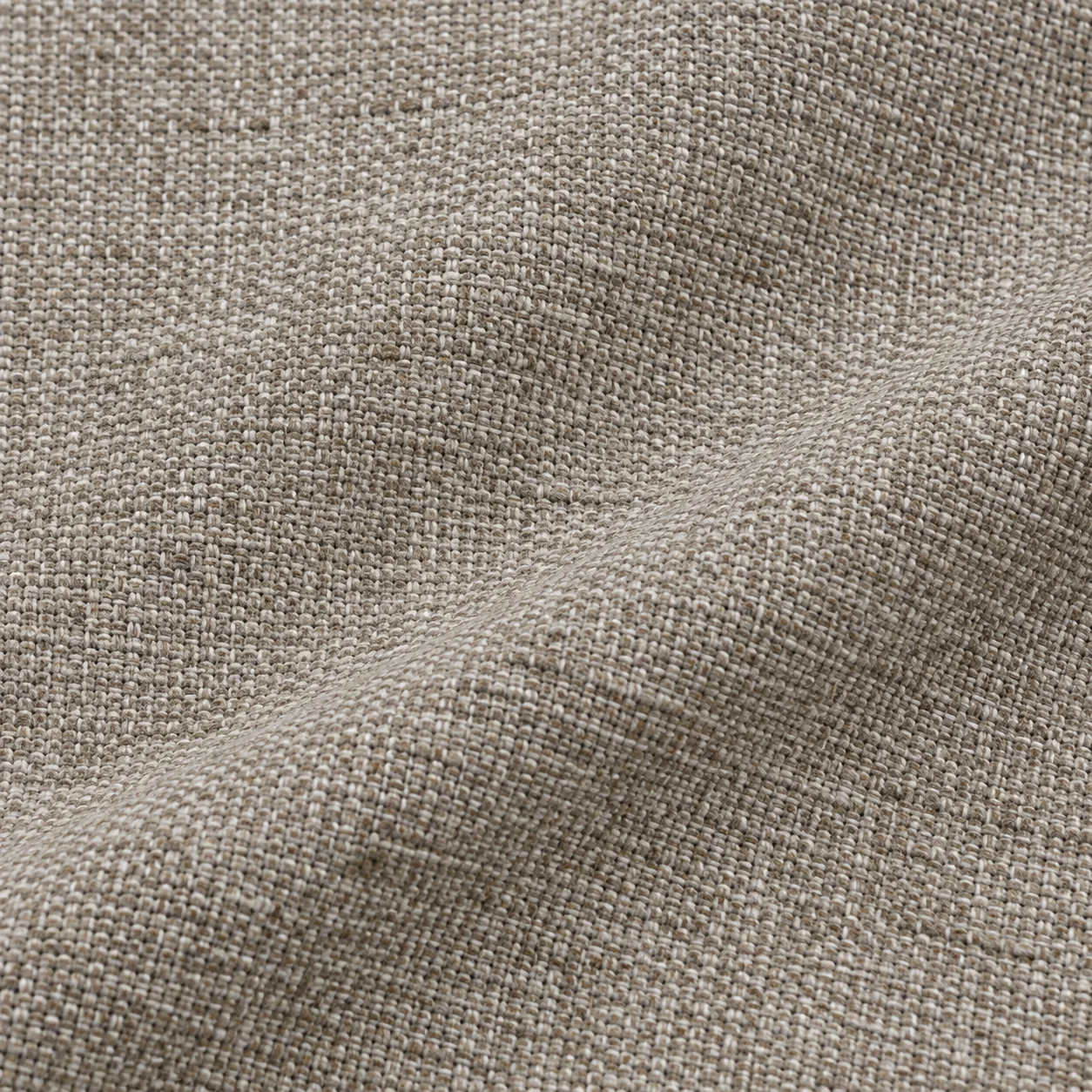 Greige linen-blend upholstery fabric folded to show the weave