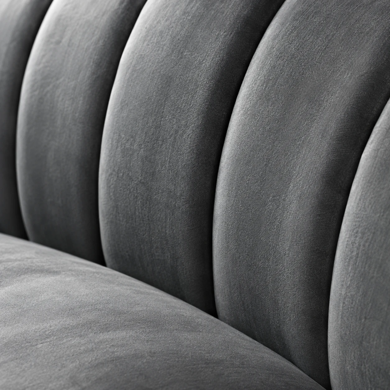 Grey velvet chair back with wide vertical channel tufting
